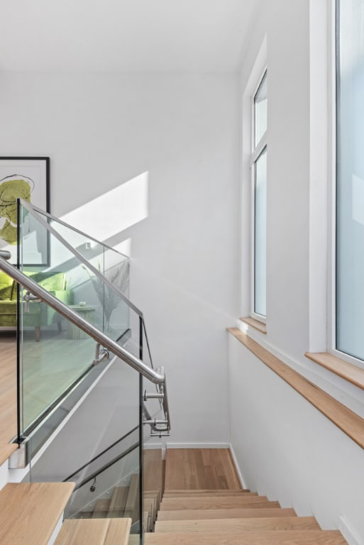 staircase featuring wood-type flooring