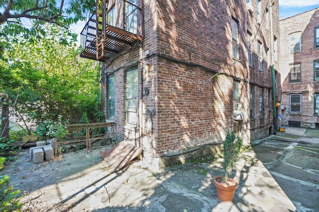 view of property exterior with brick siding