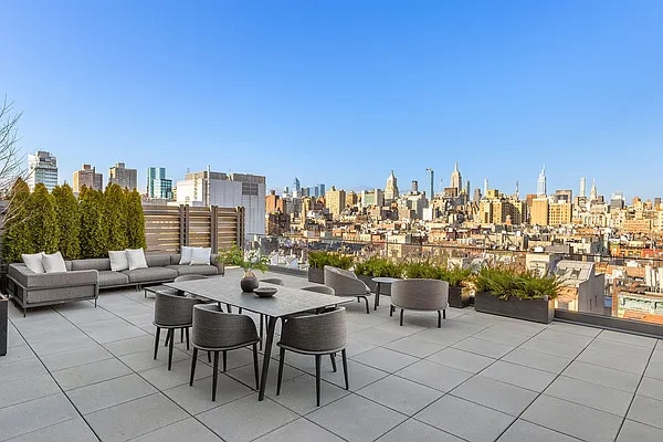 view of patio featuring an outdoor hangout area and a city view