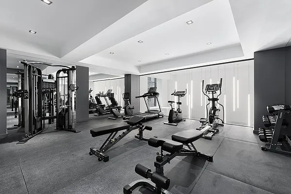 exercise room with a raised ceiling