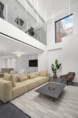 living room with a high ceiling