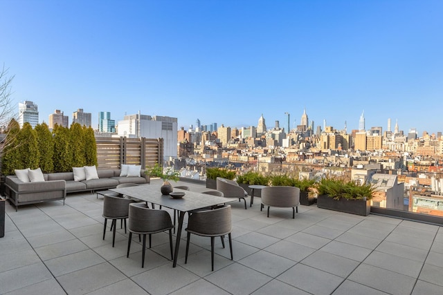 view of patio with a view of city and an outdoor hangout area