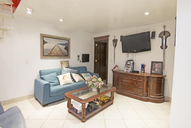 living room featuring recessed lighting, light tile patterned flooring, and baseboards