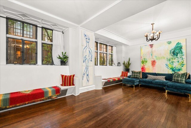 1 W 67th St Unit 2E, New York City, NY 10023 - living room with plenty of natural light, wood finished floors, and a chandelier