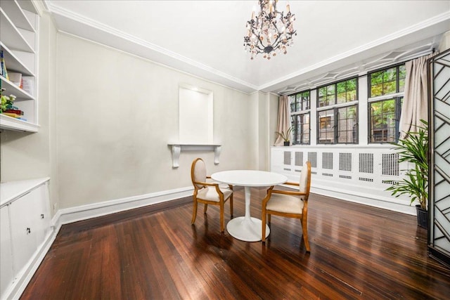 dining area with dark hardwood / wood-style floors, ornamental molding, and a notable chandelier