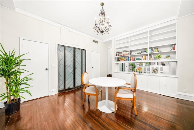 1 W 67th St Unit 2E, New York City, NY 10023 - dining room featuring hardwood / wood-style floors, crown molding, a chandelier, built in shelves, and baseboards