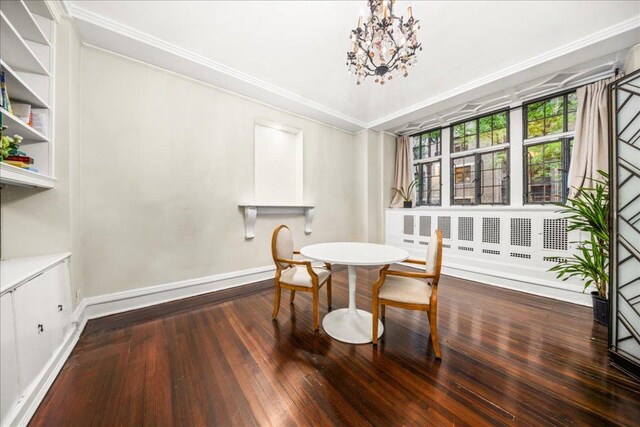 dining area featuring dark wood-type flooring