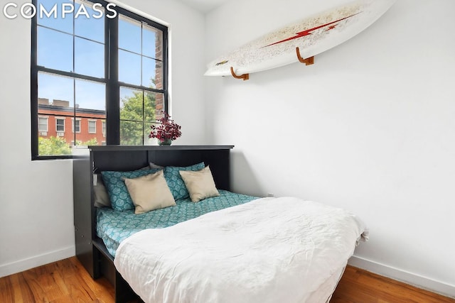 bedroom featuring wood-type flooring