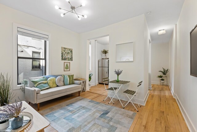 bedroom with radiator heating unit, hardwood / wood-style floors, and a closet