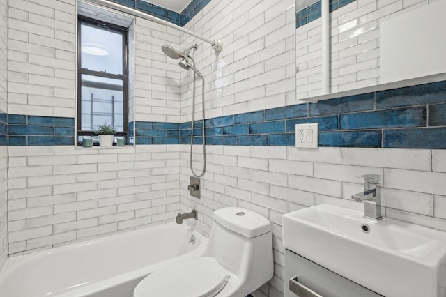 full bathroom with toilet, tile walls, vanity, tiled shower / bath combo, and decorative backsplash