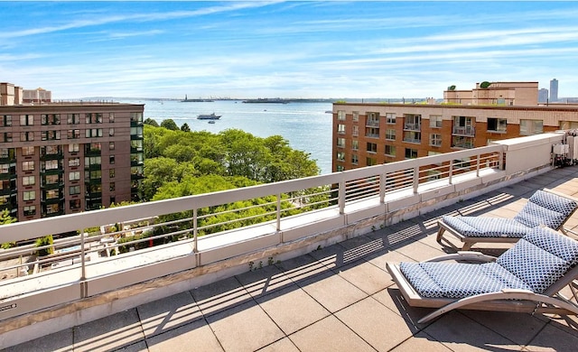 balcony featuring a water view