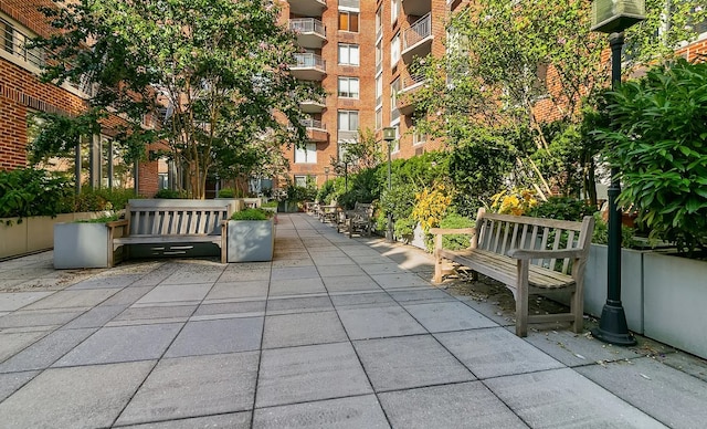 view of home's community with a patio area