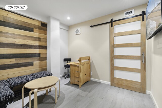 interior space with sink and a barn door