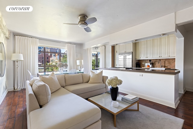 living room featuring ceiling fan, dark wood finished floors, visible vents, and baseboards