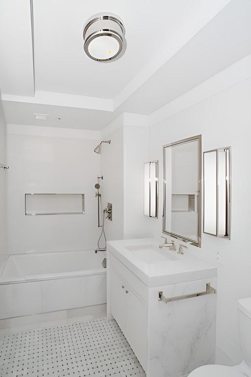 full bathroom featuring vanity, toilet, and bathing tub / shower combination