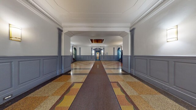 hallway featuring crown molding