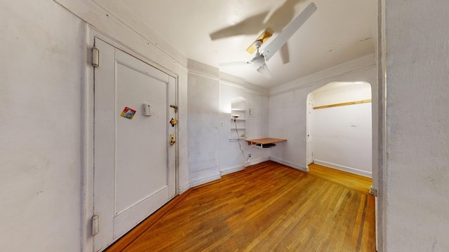 interior space with hardwood / wood-style floors and ceiling fan