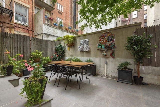 view of patio / terrace with outdoor dining area and a fenced backyard