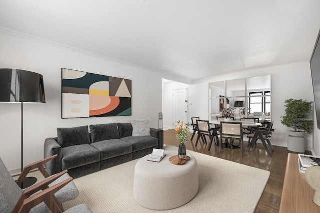 living room featuring ornamental molding and dark parquet flooring