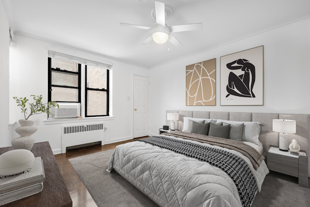 bedroom featuring ceiling fan, ornamental molding, and radiator