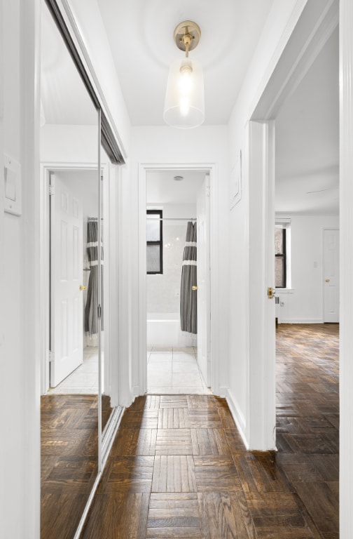 hall featuring dark parquet floors