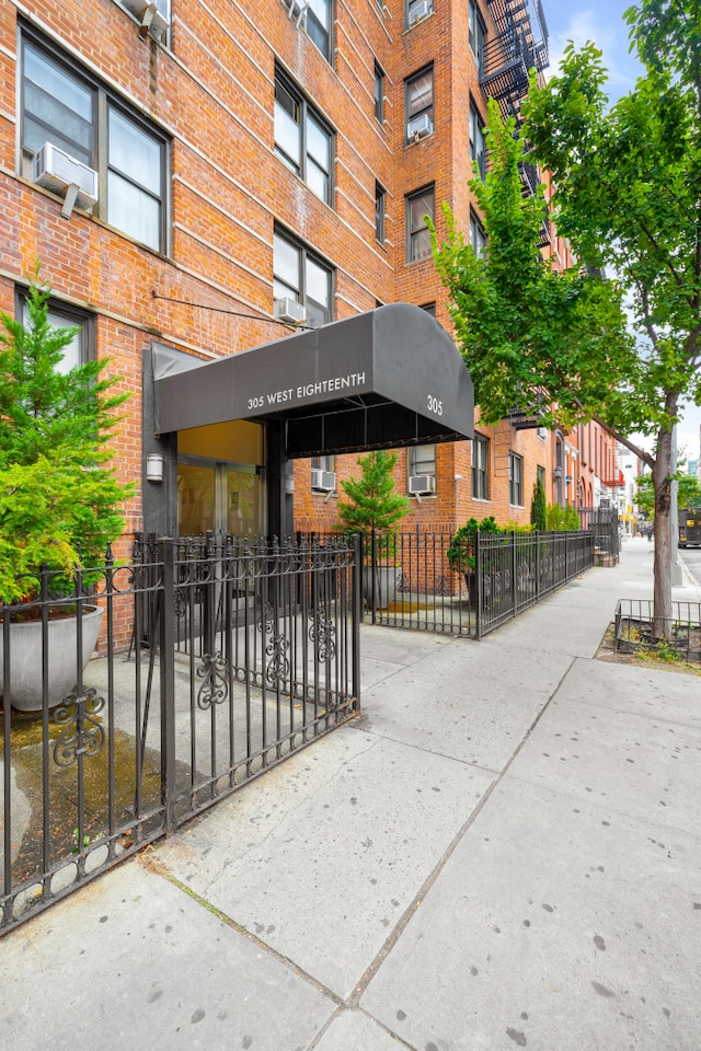 305 W 18th St Unit 1K, New York City, NY 10011 - view of building exterior with fence