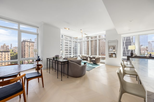 living room with floor to ceiling windows and plenty of natural light