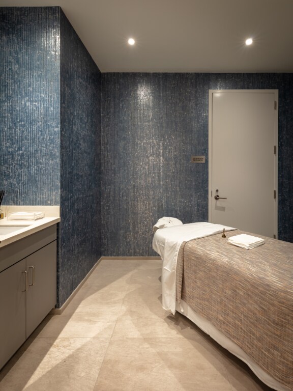 bathroom with vanity, separate shower and tub, and tile walls