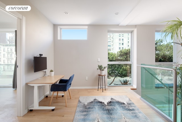 office area featuring light wood-type flooring, visible vents, baseboards, and recessed lighting