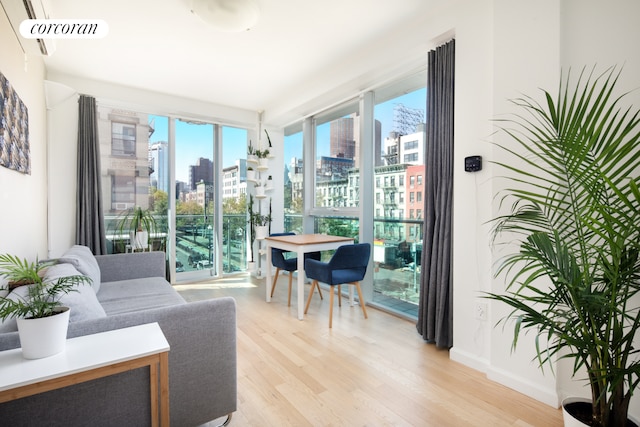 sunroom / solarium with a view of city and visible vents