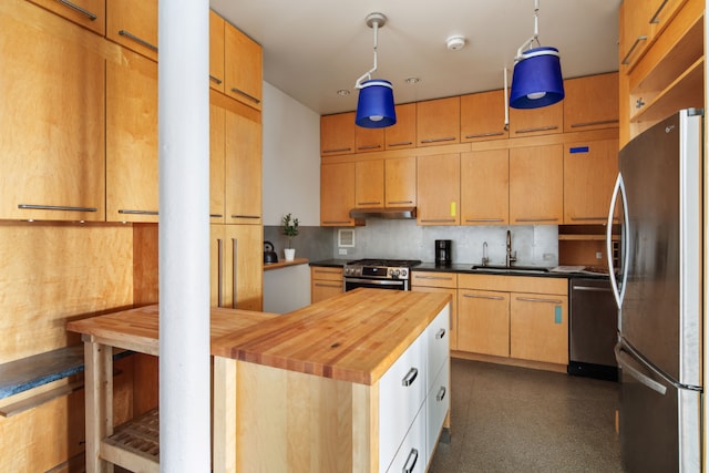 kitchen with butcher block countertops, sink, appliances with stainless steel finishes, backsplash, and decorative light fixtures