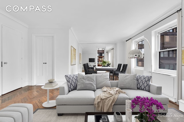 living room with ornamental molding