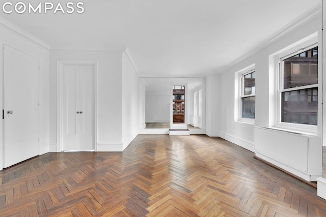 unfurnished living room with dark parquet floors