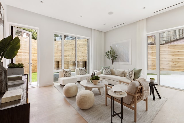 living room with light hardwood / wood-style flooring