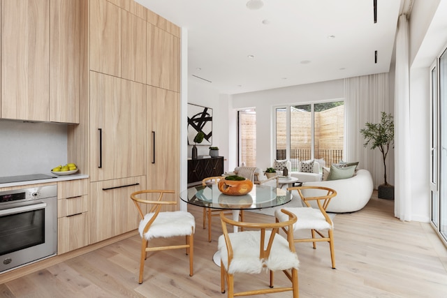 dining space featuring light hardwood / wood-style flooring