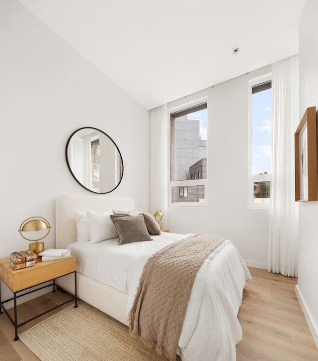 bedroom with light hardwood / wood-style flooring