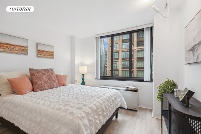 407 Park Ave S Unit 17F, New York City, NY 10016 - bedroom with wood finished floors and baseboards