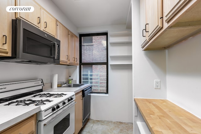 kitchen featuring a sink, white range with gas stovetop, dishwasher, and light brown cabinetry