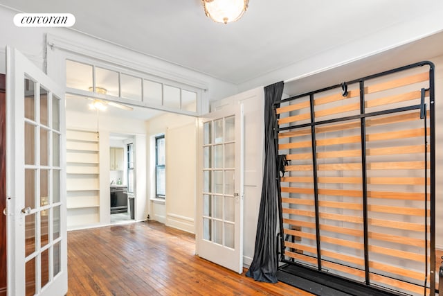 interior space featuring wood-type flooring, visible vents, and french doors