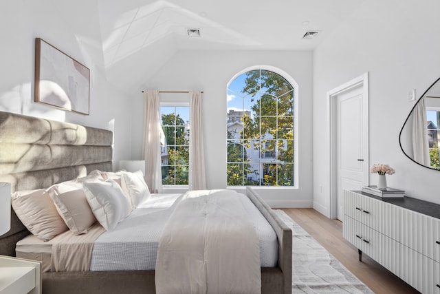 bedroom featuring visible vents and wood finished floors