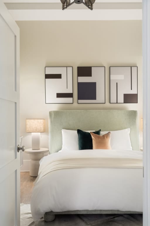 bedroom with a chandelier and hardwood / wood-style floors