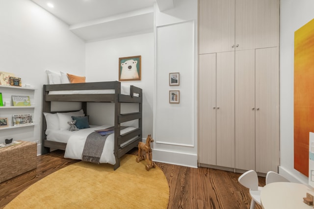 bedroom with a closet and light hardwood / wood-style flooring