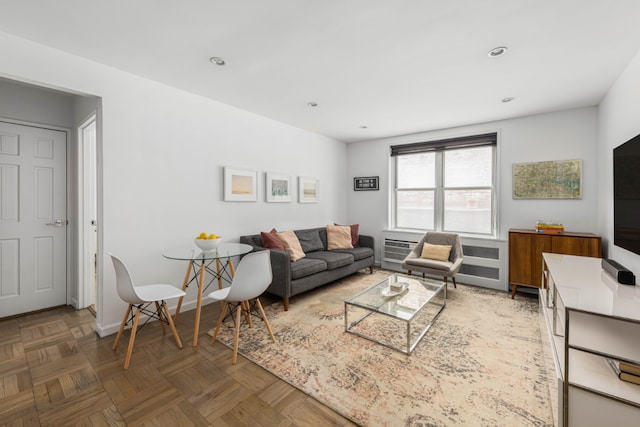 living room featuring dark parquet floors