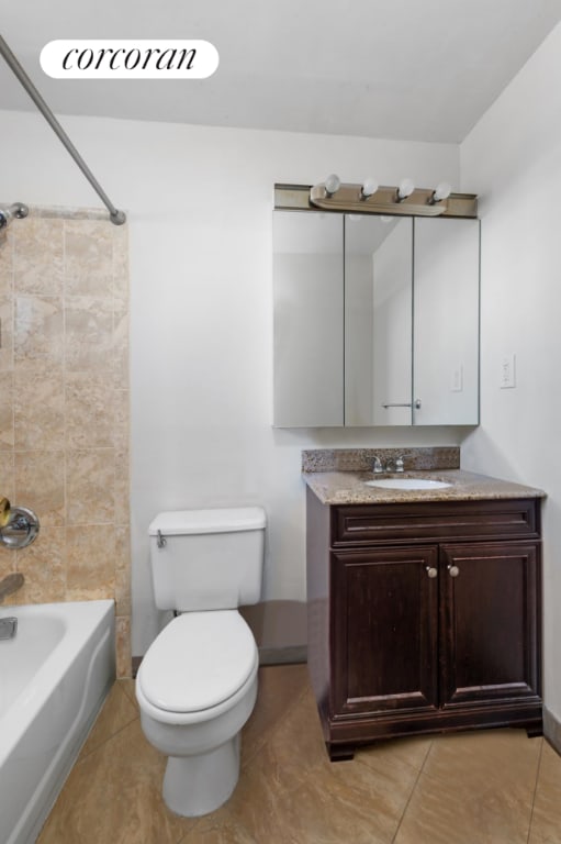 full bathroom with vanity, tile patterned floors, toilet, and shower / bathing tub combination