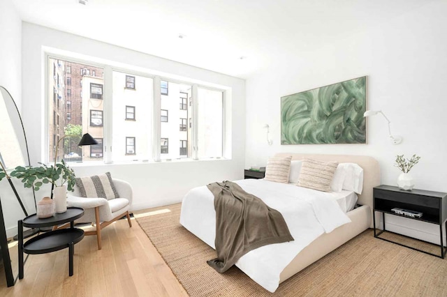 bedroom featuring light wood-style floors