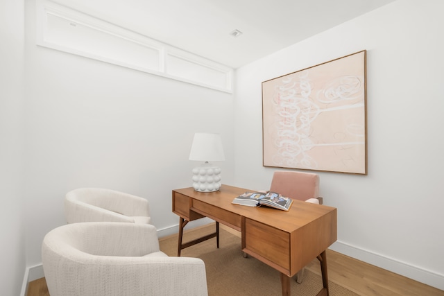 office space featuring light wood finished floors and baseboards