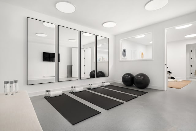 exercise room with baseboards