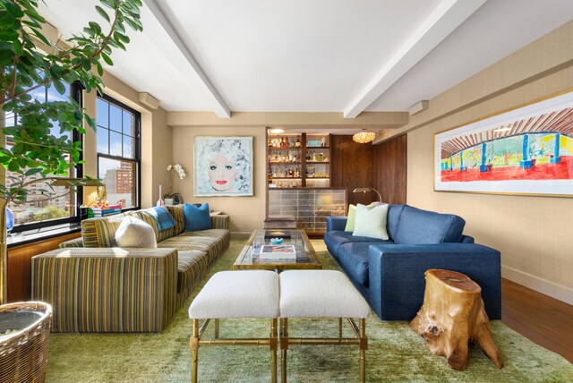 living room with beam ceiling and hardwood / wood-style floors