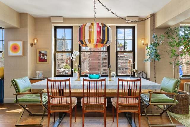 dining area with wood finished floors