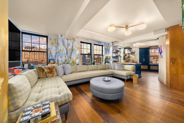 living room with wood-type flooring and beamed ceiling